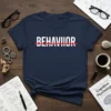 Navy t-shirt with the word "BEHAVIOR" in white capital letters, crossed out by a red line