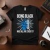 Black t-shirt with white text "BEING BLACK WAS ALL WE EVER 717" and a blue raised fist holding a shield