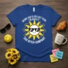 Blue t-shirt with white text: "Being Sad is So Last Year, I'm Over It Sad Bitch Company" and a smiling