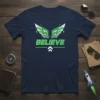 Navy blue t-shirt with the word BELIEVE in bright green, flanked by stylized green and white wings