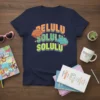 Navy t-shirt with BELULU SOLULU SOLULU text and colorful brain graphics, promoting mental health awareness and quirky style
