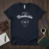 Navy t-shirt with white text "Bendiión" above hands holding a star, with a halo and sparkles