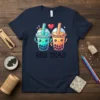 Bes Teas text with two cute, smiling bubble tea cups, one with a crown, on a navy t-shirt