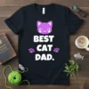 Best Cat Dad t-shirt with a cute purple cat face and paw prints. White text reads "BEST CAT DAD."