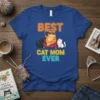 Best Cat Mom Ever t-shirt design with three cartoon cats, one large orange cat wearing sunglasses sitting on a pillow