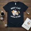 Best Cat Mom Ever text with a cute mother cat cuddling two kittens graphic on a navy t-shirt