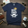 Navy blue t-shirt with white "Best Dad Ever" text, a gold crown, and a white mustache graphic