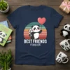 Best Friends Forever t-shirt design with two pandas holding a heart balloon and retro sunset graphic