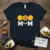 Best Mom Ever t-shirt with "MOM" text, a bee, and honeycomb graphic