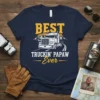 Best Truckin' Papaw Ever t-shirt design featuring a semi-truck, mountains, and sunset graphic
