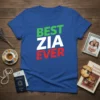 Blue t-shirt with "BEST ZIA EVER" text in green, white, and red. Primary keyword "Best Zia Ever" is prominently displayed