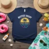 Navy blue t-shirt with "Besties Vacay" text above a retro palm tree sunset graphic and linked hearts