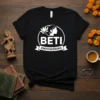 Beti Empowering t-shirt with white text and a profile silhouette of a woman with a lotus flower