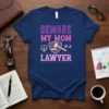 Beware My Mom Is A Lawyer text design with gavel and scales of justice graphic on navy t-shirt