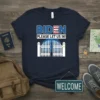 Navy t-shirt with "BIDEN PLEASE LET US IN!" text and a graphic of an open white gate and house