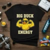 Black t-shirt with "BIG DUCK ENERGY" text and a cartoon muscular duck wearing sunglasses