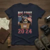 Big Foot wearing sunglasses and bandana stands at a podium with "Vote" emblem, "Big Foot Here Since 1776 Vote 2024"