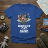 Bigfoot Cat Alien Space Adventure Team t-shirt design featuring cartoon Bigfoot, cat, and alien in a UFO taking a selfie