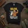Bigfoot and cat taking a selfie with text "SELFIE BIGFOOT & CAT FOREST TOUR '24" on a black t-shirt
