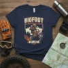 BIGFOOT MOTO CLUB EST. 1967 design featuring Bigfoot riding a dirt bike with mountains and trees