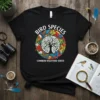 Black t-shirt with "Bird Species Common Backyard Birds" text and a circular design of various birds around a tree