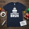 Birthday Bruh t-shirt featuring a white graphic of a birthday cake with candles and bold white text reading "BIRTHDAY BRUH"