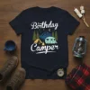 Birthday Camper T-Shirt with graphic of a camper, tent, campfire, mountains, and stars