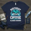 Birthday Cruise Squad Alaska Bound text and graphic on a navy blue t-shirt featuring a cruise ship, mountains, and aurora
