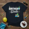 Birthday Dude t-shirt design with festive party hats, balloons, and confetti, featuring bold white text and a grey stylized "Dude"