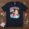 Birthday Girl text with a cute mermaid holding a cake on a navy blue t-shirt