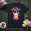 Birthday Girl T-Shirt featuring a cute pink pig wearing a party hat and holding a gift, with "BIRTHDAY Girl" text