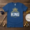 Blue t-shirt with "Birthday King" text and a golden crown graphic above, designed for birthday celebrations