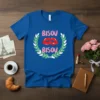 Bisou Bisou French phrase with red lips graphic on a blue t-shirt