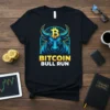 Black t-shirt with "BITCOIN BULL RUN" text and a powerful blue bull graphic featuring the Bitcoin logo on its forehead