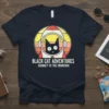 Black Cat Adventures Journey To The Unknown t-shirt featuring a black cat in a space helmet against a sunset and