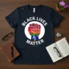 Black Lives Matter fist graphic t-shirt with text in white and colorful inside the fist, showing roots below