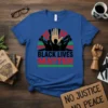 Black Lives Matter t-shirt with bold text, raised fists, and a central hand graphic, symbolizing unity and the fight for