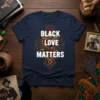 Black Love Matters text with raised fist and rose graphic on navy t-shirt