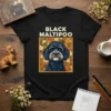 Black Maltipoo dog portrait design with floral background and text "BLACK MALTIPOO" on a black t-shirt