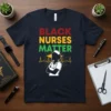 Black Nurses Matter text with nurse silhouette and heartbeat graphic on navy t-shirt