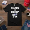 Black t-shirt with "BLACKS FOR TRUMP" text, a raised fist, US flag, and elephant graphic