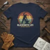 Blacksmith Life The Beat Goes On t-shirt design with silhouette of blacksmith hammering anvil, heartbeat graphic, and retro sunset circle