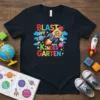 Blast Off Into Kindergarten t-shirt with colorful rocket ship, planets, and books, perfect for school kids