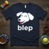 Navy blue t-shirt with white "blep" text and a white smiling dog face with its tongue sticking out