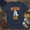 Navy t-shirt with "BLESS 'EM" text and praying hands graphic in orange and white