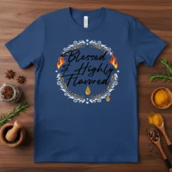 Blessed & Highly Flavored text design with flames and dripping golden accents on a navy blue t-shirt