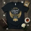 Blessed by God for 35 Years text with gold wings and halo graphic on a black t-shirt
