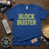 Block Buster text design on a blue t-shirt, with yellow retro-style font, evoking a classic movie rental store feel