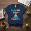 Blooms Before Maslow quote t-shirt with a colorful pyramid graphic, ideal for psychology teachers and students