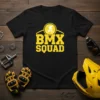 BMX SQUAD text with a silhouette of a cyclist on a bike, bold yellow design on a black t-shirt